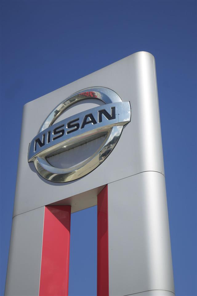 Nissan Sign Against Blue Sky