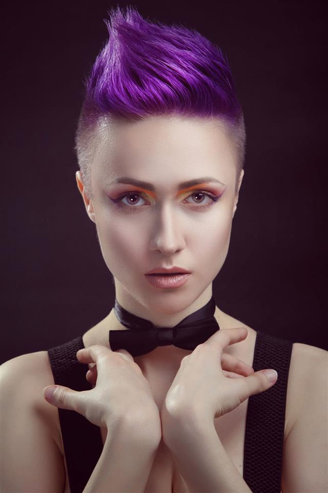 a girl with a purple color pixie hairstyle