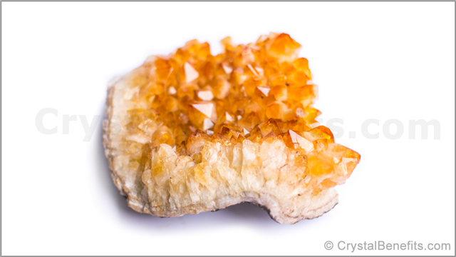 Citrine crystal on white surface