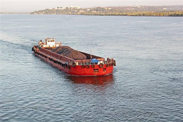Cargo barge carrying iron ore