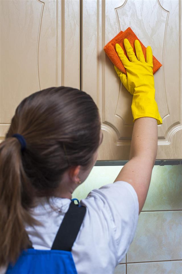 Cleaning kitchen cabinet