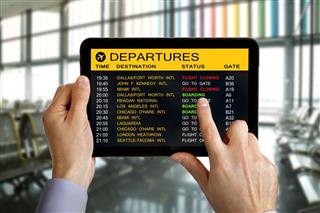 Digital tablet in airport with flight information