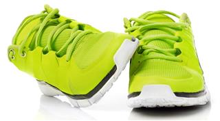 Green color running shoes
