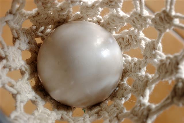 White billiard ball in pocket