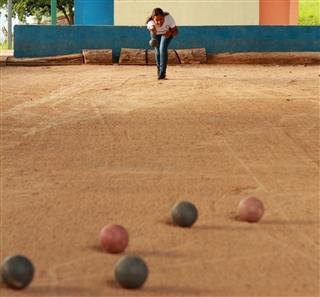 Lady Playing Bolas Criollas