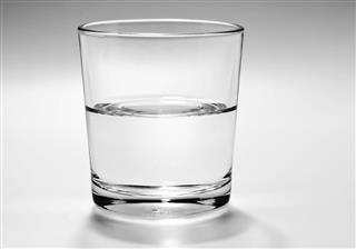 Half full, half empty glass of water