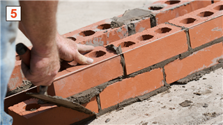 Bricklayer Laying Bricks