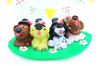 Homemade cake topper (polymer-clay), cartoon dogs in row wearing top-hats