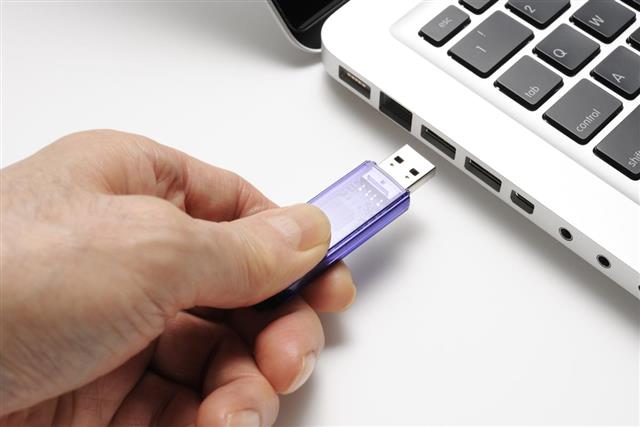 Isolated shot of connecting USB flash drive