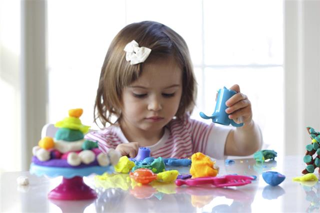 Girl playing with playdough