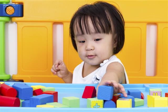 Asian Little Chinese Girl Playing Wooden Blocks