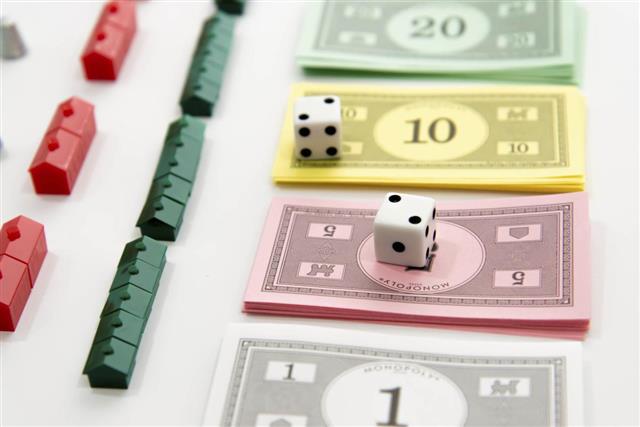 Monopoly board game pieces and money