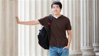 Asian young man student with backpack