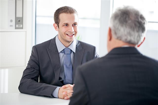Man in business attire at an interview