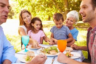family eating together outdoors
