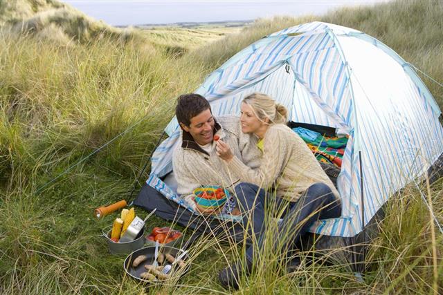 couple eating at campsite