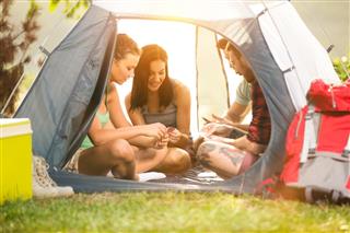 Happy friends in tent