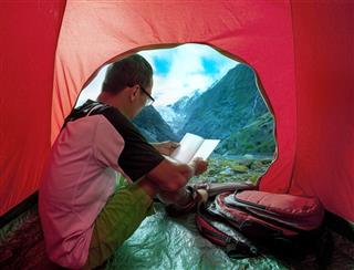 Camping man reading