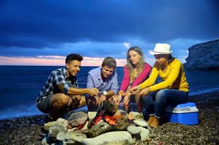 Friends camping on beach