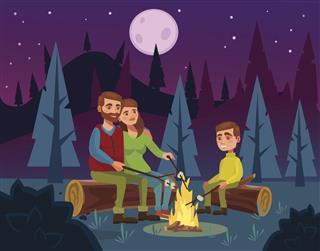 Family picnic by campfire