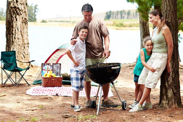 Family cooking on camping