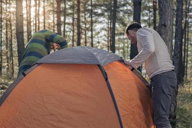 men pitching the tent