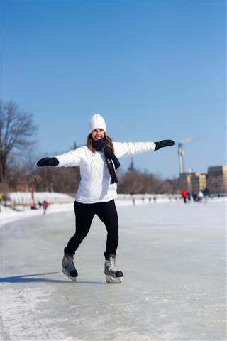 Woman Ice Skating During Winter