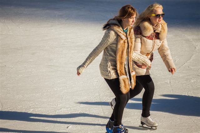 Two Girls Of Teenagers On The Ice