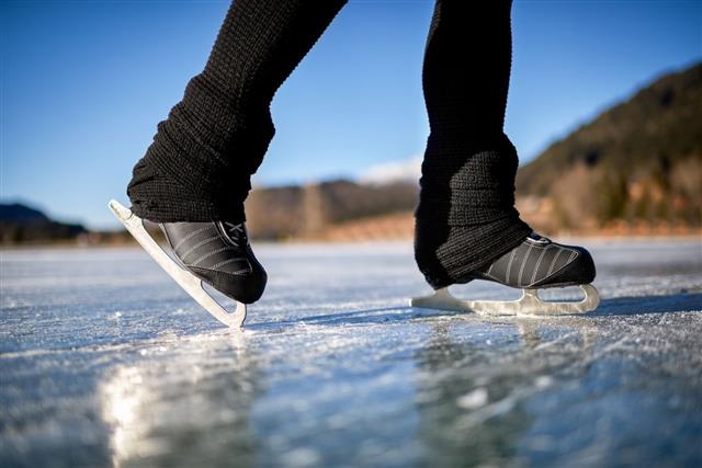 Ice Skating On Frozen Lake