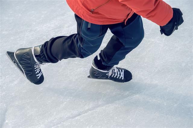 Ice Skaters Feet On Ice Rink