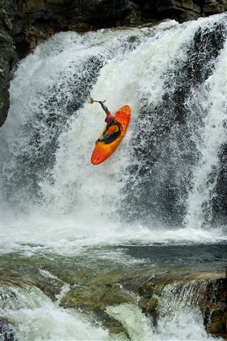 Kayaker In The Waterfall