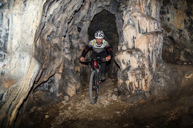 Mountain Bike Racer In Karst Cave