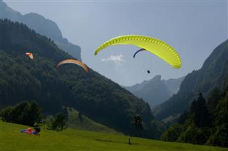 Paragliders In The Swiss Alps