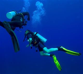 Two Divers With Air Bubbles