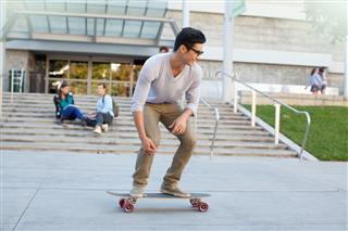 Student skateboarding in campus