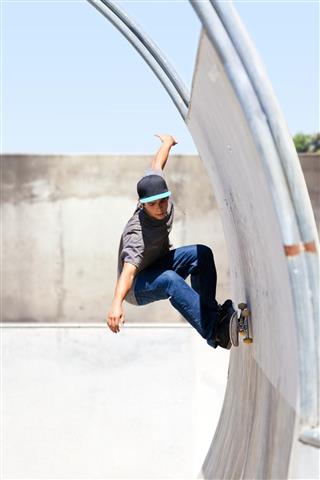 Skateboarder In Tube