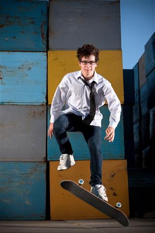 Young Businessman Skateboarding