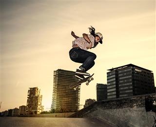 skateboarder jumping in the city