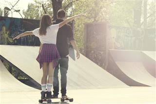 happy couple at skate park
