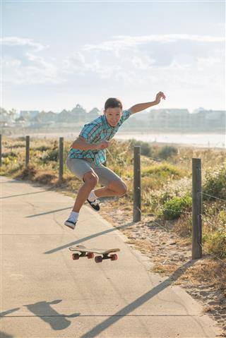 Teenager jumping with skateboard