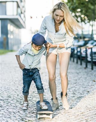 Mom and son with skateboard