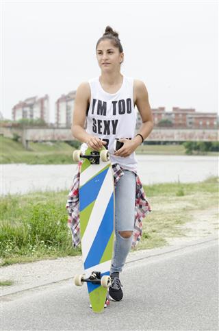 young woman with skateboard
