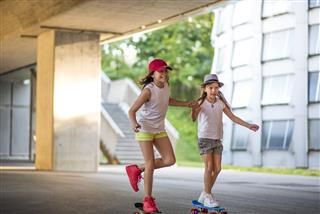 Girls riding skateboard