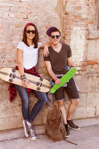 attractive couple with skateboards