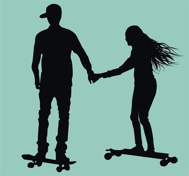 Teen Couple Skateboarding