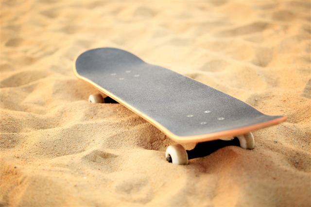 Skateboard On Beach