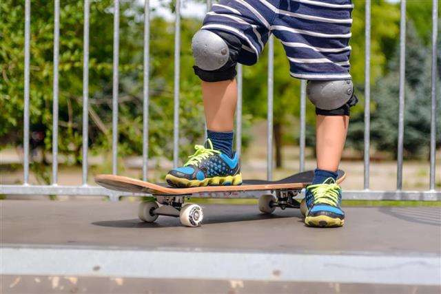 boy with skateboard on a ramp