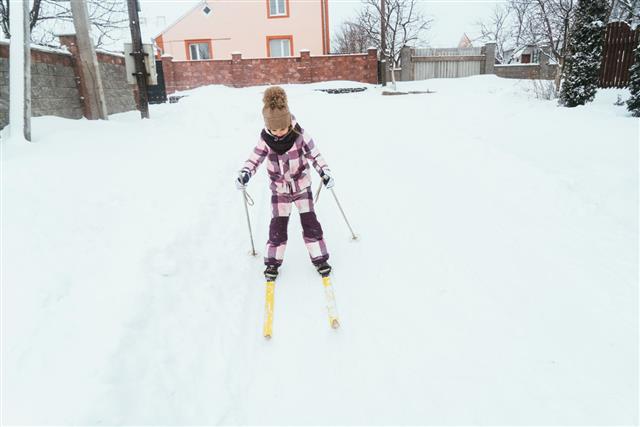 Girl Of Elementary Age Skiing