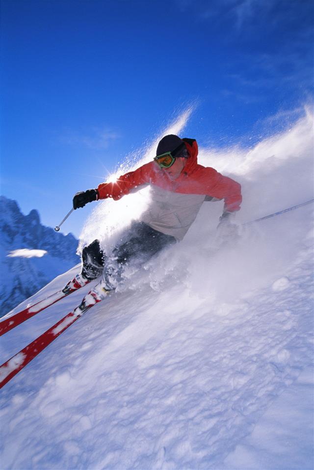 Man Skiing Down Steep Slope