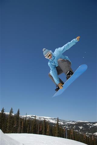 Snowboarder Big Air Over A Jump